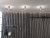 Bullo Plafond aluminium/klar glas i en hall